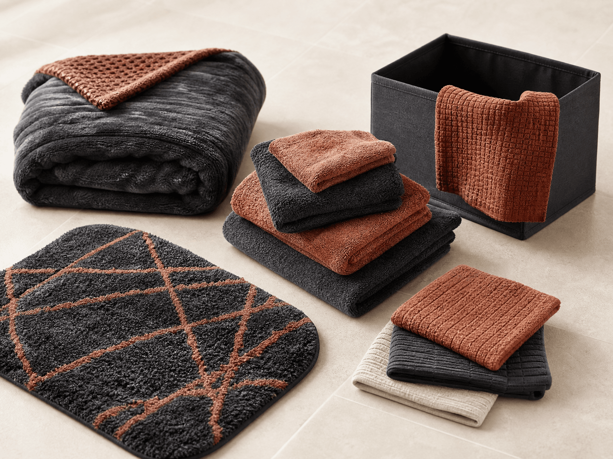 Blanket, towel set, door mat, storage box and cleaning cloths grouped as a move-in kit